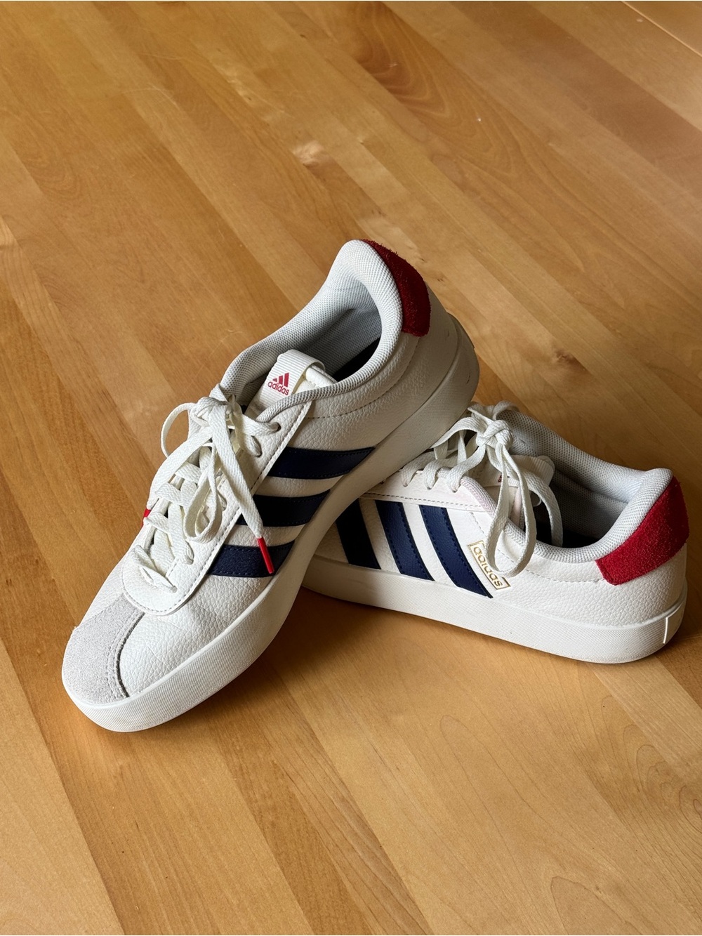Adidas Women’s Sneakers in White with Navy Stripes and Red Heel